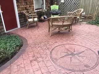 Red block patio with compass design
