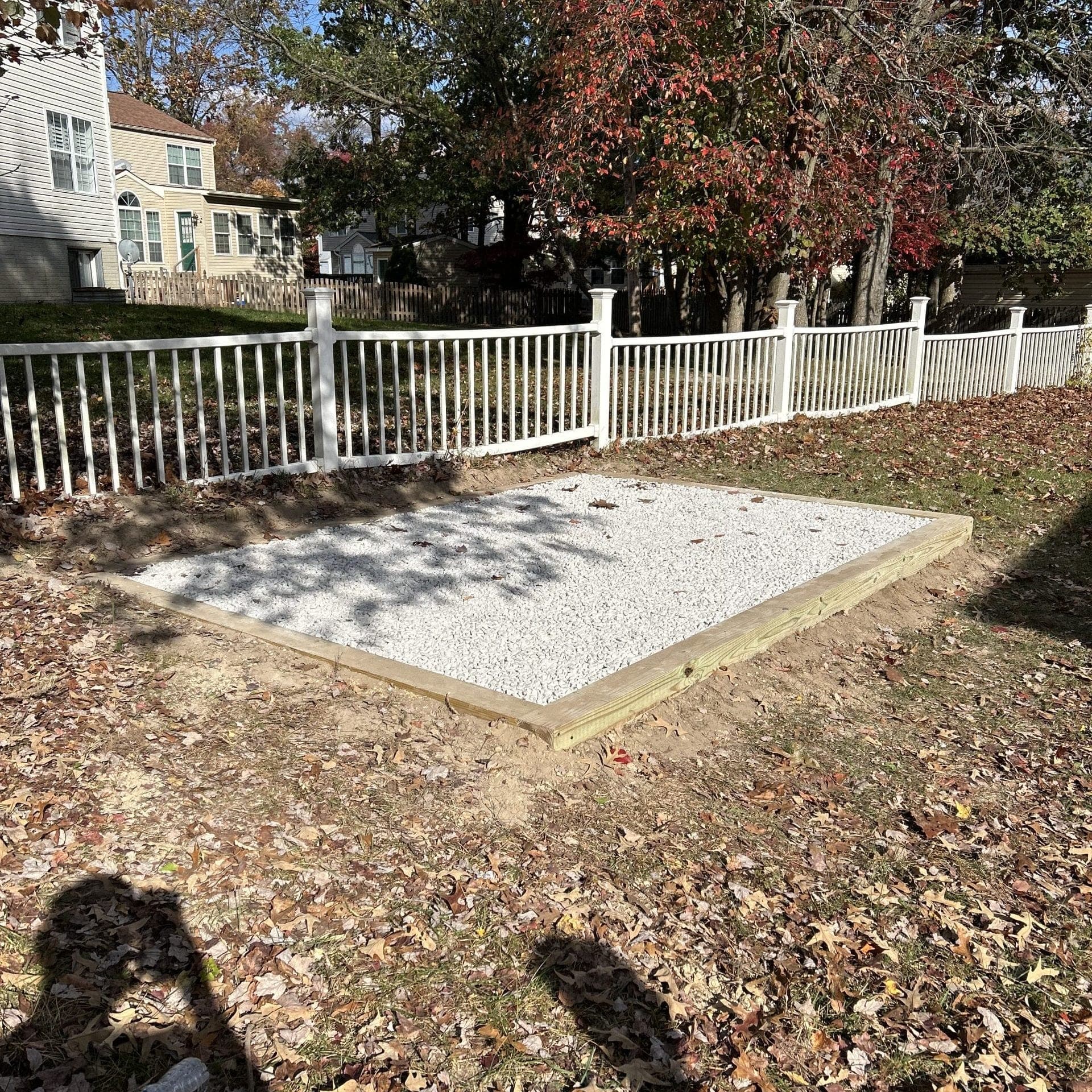 Gravel pad foundation installed by Backyard Bobby's for shed in Anne Arundel County