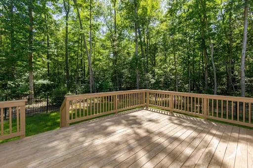 Custom wood deck with railing built by Backyard Bobby's in Anne Arundel County